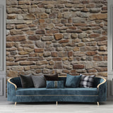 Stone wall mural in modern living room showing textured beige and terracotta tones creating warm atmosphere