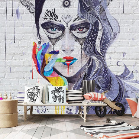 Street art mandala portrait wallpaper creating a bold statement wall in a modern living room with minimalist furniture