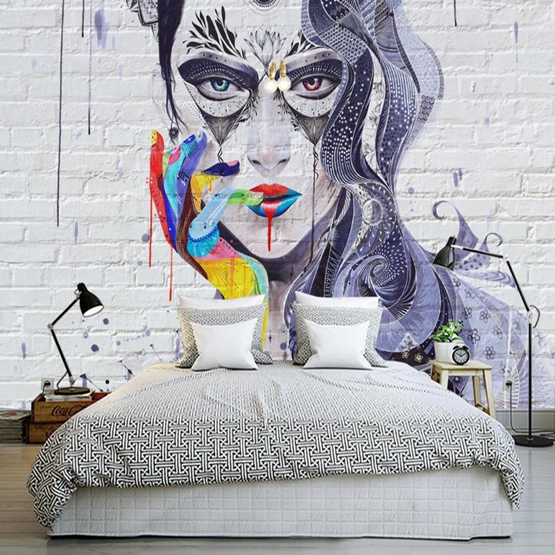 Abstract mandala portrait mural wallpaper transforming an urban coffee shop wall with vibrant colors
