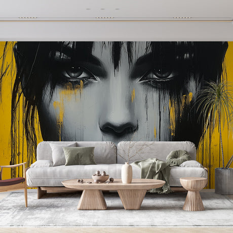 Street art portrait mural wallpaper styled in a modern loft living room, showing dramatic black and yellow design on accent wall