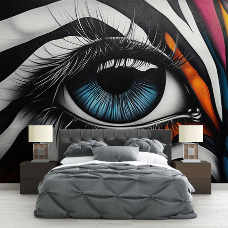 Street art eye mural wallpaper creating a bold statement in a modern living room with clean white furniture