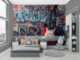 Graffiti mural with guitar creating impact in teen bedroom