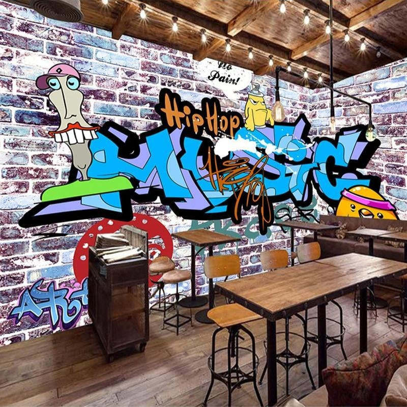 Street art graffiti wallpaper creating bold impact in modern living room with grey sofa and urban decor