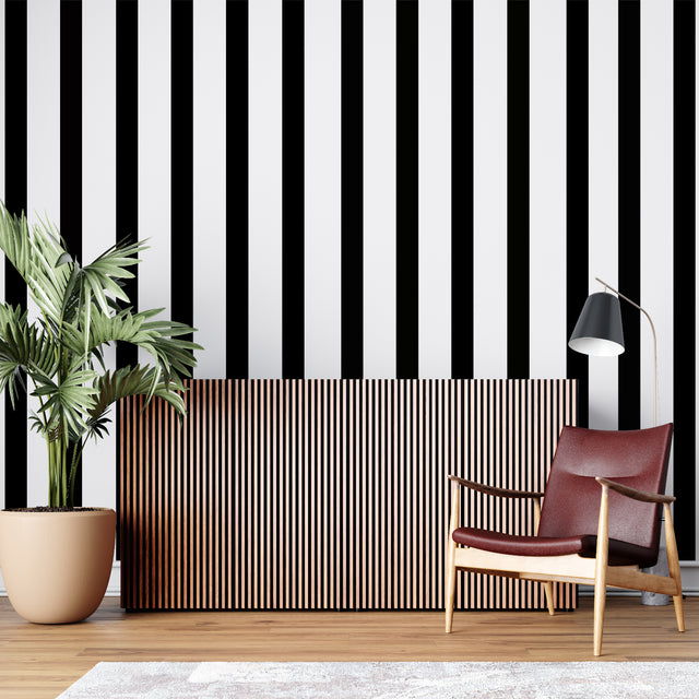 Black and white striped wallpaper creating height in modern living room with gray sofa