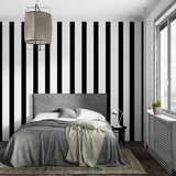 Modern dining room with black and white striped accent wall