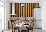 Vertical striped wall mural creating height in a contemporary dining space