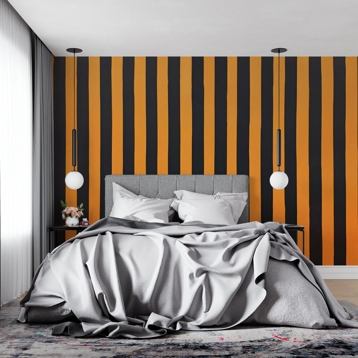 Orange and black striped wallpaper adding drama to a modern home office