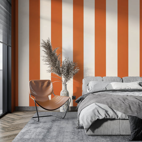 Modern living room with orange and white striped wallpaper creating a bright, energetic atmosphere