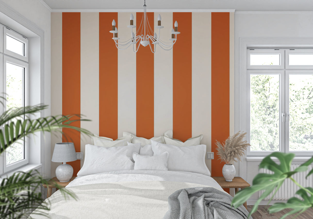 Hallway transformed with modern orange and white striped wallpaper creating depth