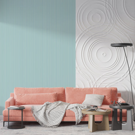 Mint green striped wallpaper in a modern living room creating an airy, sophisticated atmosphere