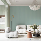 Vertical mint stripes wallpaper making a home office look taller and more professional