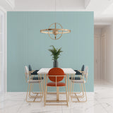 Striped mint green wallpaper bringing fresh energy to a bright dining room