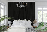 Modern black wood stripe wallpaper in a minimalist living room with tall windows and contemporary furniture