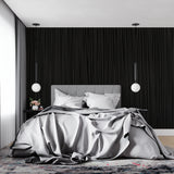 Modern office space featuring black wood grain wallpaper with ambient lighting