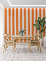 Orange and white vertical stripes making a home office look bigger and more organized