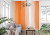 Striped wallpaper bringing modern style to a dining room with clean orange lines