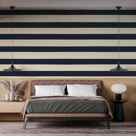 Modern navy blue striped wallpaper in a bright home office, creating a professional and clean backdrop for remote work