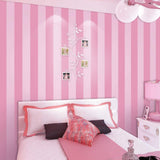 Vertical pink and white striped pattern creating depth in a bright dressing room