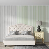Green and white striped wallpaper in home office setting with natural light