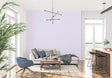 Lavender striped wallpaper in a modern bedroom creating a serene atmosphere with natural light