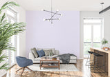 Lavender striped wallpaper in a modern bedroom creating a serene atmosphere with natural light
