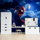 Marvel hero wallpaper installation in gaming room with dramatic night scene