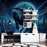 Night scene mural adding drama to a play area with urban skyline and web patterns