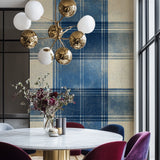 Scottish-inspired tartan wallpaper bringing warmth to a bedroom
