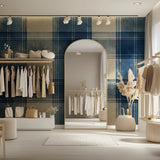 Blue tartan wallpaper creating depth in an entryway setting