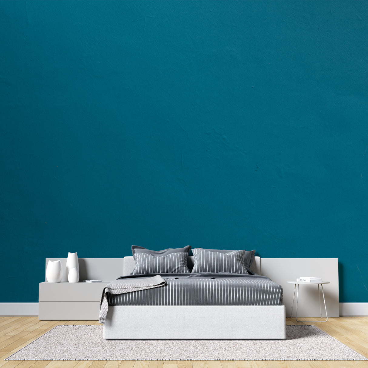 Contemporary office space with teal wallpaper mural creating focused atmosphere