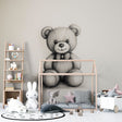 Black and white teddy bear wallpaper creating a cozy atmosphere in a modern nursery with neutral decor