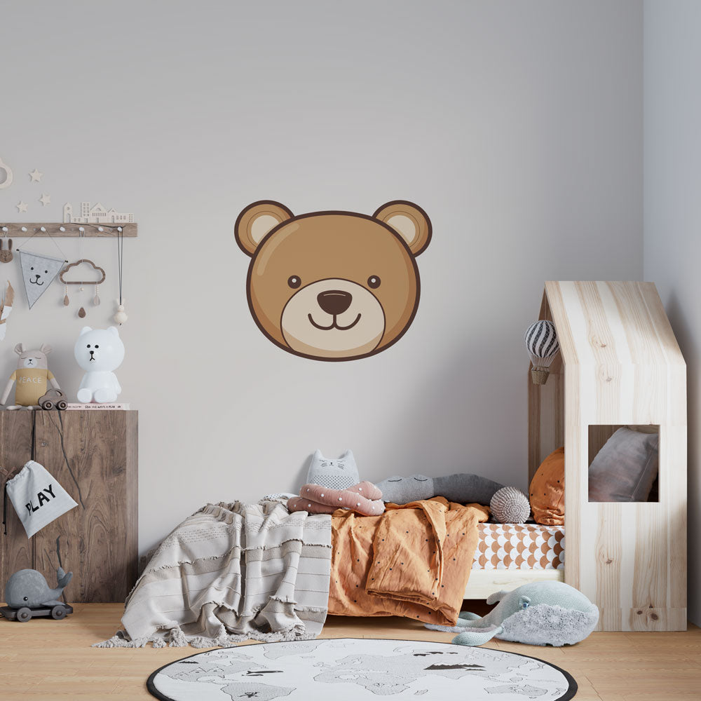 Teddy bear wallpaper creating a cozy atmosphere in a modern nursery with white furniture and natural light
