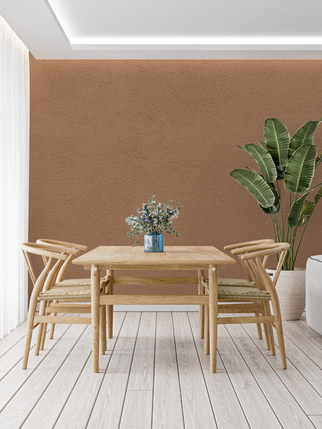 Terracotta wall mural creating a warm atmosphere in a modern living room with minimal furniture