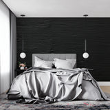 Modern wave pattern wallpaper in bedroom showing ripple texture detail
