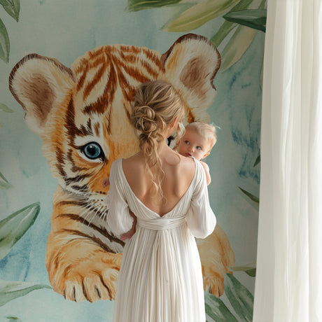 Baby tiger wallpaper creating a magical atmosphere in a modern nursery with soft mint accents
