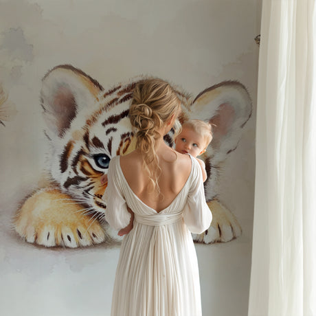 Tiger cub wallpaper creating a magical atmosphere in a bright nursery with white furniture