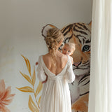 Baby Tiger Wallpaper in bedroom setting with natural light and pastel decor