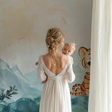 Baby tiger wallpaper mural styled in modern nursery with white furniture and soft textiles