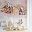 Tiger cub watercolor wallpaper in a cozy nursery with soft pink accents
