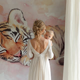 Sleeping tiger wallpaper bringing warmth to a modern bedroom