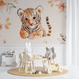 Baby tiger wallpaper in modern nursery with rocking chair and mobile, showing soft watercolor design