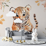 Tiger cub wallpaper creating peaceful atmosphere in baby's room with white furniture