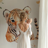 Baby tiger mural in neutral nursery with minimalist decor