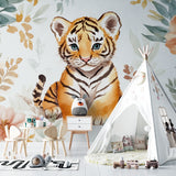 Tiger cub wallpaper in cozy nursery with white furniture and soft pink accents