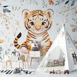 Watercolor Tiger Nursery Wallpaper creating a cozy atmosphere in a modern white nursery with wooden furniture