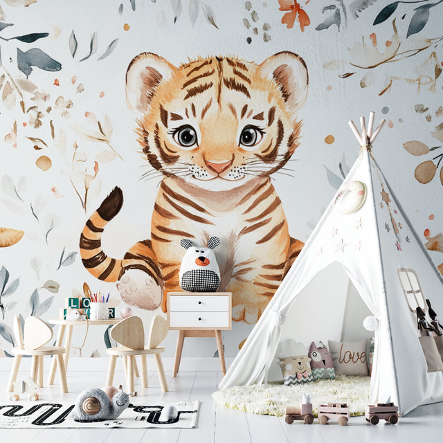 Watercolor Tiger Nursery Wallpaper creating a cozy atmosphere in a modern white nursery with wooden furniture