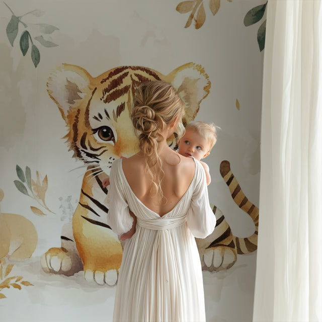 Watercolor Tiger Nursery Wallpaper creating a cozy atmosphere in a modern white nursery with natural wood furniture