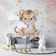 Tiger cub wallpaper bringing warmth to a modern nursery with soft pink and blue tones
