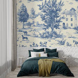 Home office featuring French toile wallpaper with built-in shelving and natural light