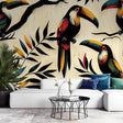 Tropical bird wallpaper with orange toucans and black leaves creating depth in a modern living room setting